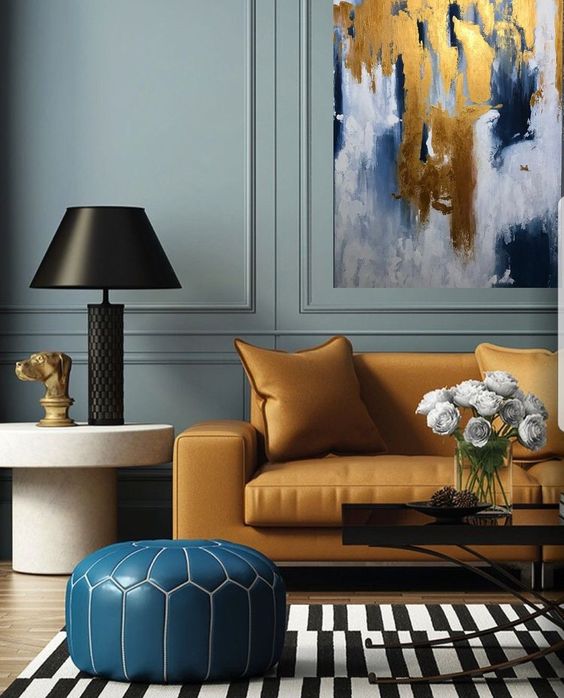 living room, wooden floor, green wall, white side table, light orange sofa, blue stools, striped rug, black coffee table