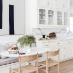 Nook, Wooden Floor, White Wall, White Cabinet, White Marble Backsplash, White Ovale Table, Wooden Chairs, White Bench, Grey Cushion