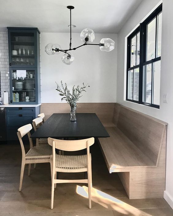 nook, wooden floor, wooden bench, black wooden table, wooden chairs, glass pendant, white wall, glass window
