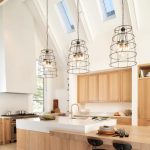 Vaulted Ceiling, Glass Ceiling Windows, Interesting Pendants With Metal, White Wall, Wooden Counter, Wooden Cabinet, Wooden Island With White Top