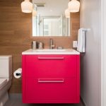 Bathroom, White Wall, Wooden Wall, Shocking Pink Floating Cabinet, White Counter Top, White Toilet, White Pendant