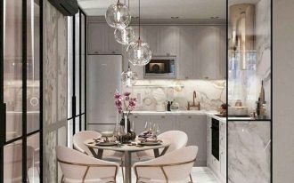 open kitchen, white marble floor, grey cabinet, glass pendants, grey marble backsplash, round table, soft pink chairs, golden legs, glass partition