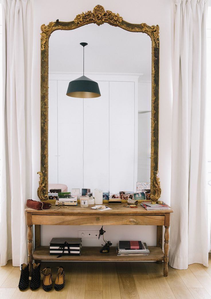 tal mirrors, on wooden table, golden frame, wooden floor