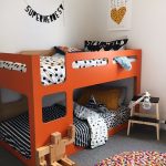 Bedroom, Grey Floor, Colorful Round Rug, Orange Bunk Bed Platform, White Wall