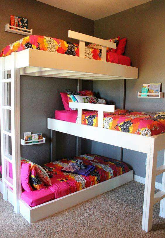bedroom, three asymmetrical beds, white wooden bed platform, stairs, colorful bedding