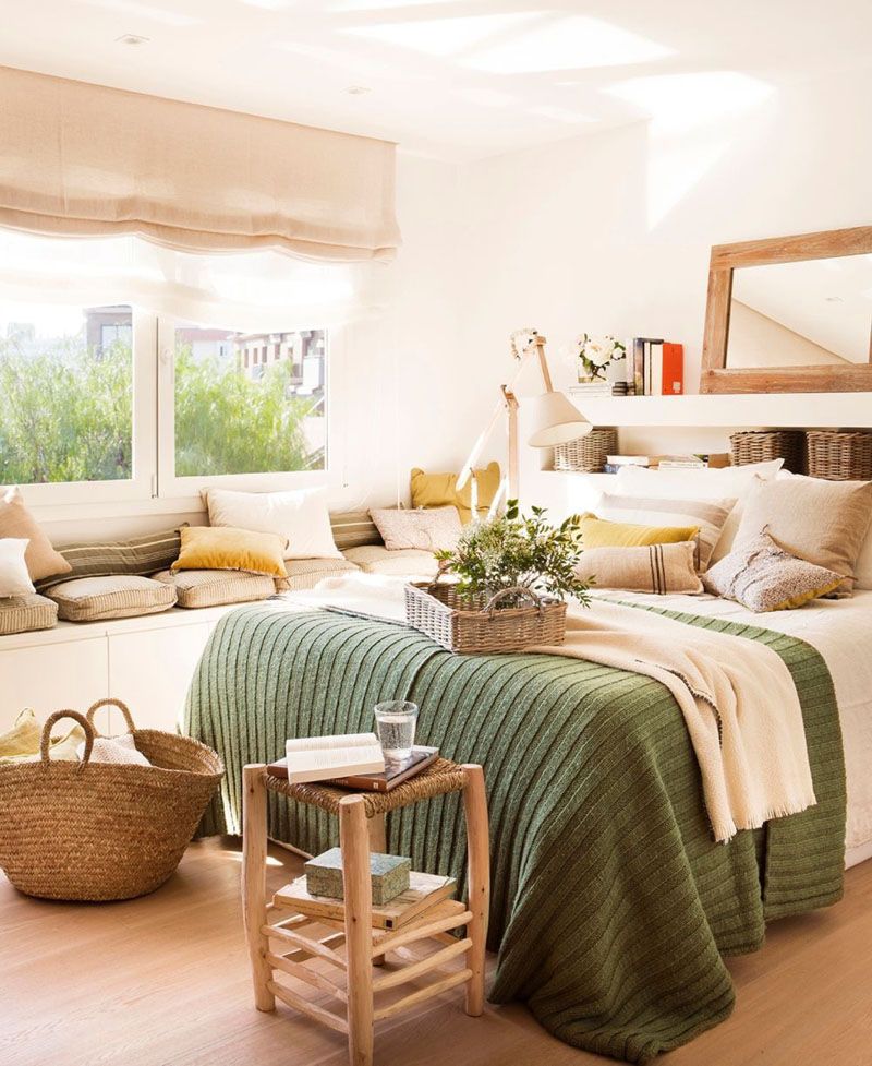 bedroom, wooden floor, white wall, white cabinet, cushions, pillows, white shelves headboard, wooden rattan side table, rattan bag,
