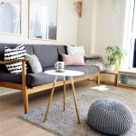 Wooden Sofa, Grey Cushion, Wooden Floor, White Round Side Table, Grey Rug, Grey Ottoman