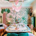 Dining Room, Wooden Floor, Pink Wallpaper With Plants, Pink Cream Chairs, Green Chair, White Chair, White Pendants With Pink Fringes, Mirror Ceiling