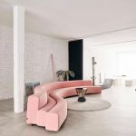 Living Room, Seamless Floor, White Exposed Wall, Pink Curvy Sofa, Round Beige Rug
