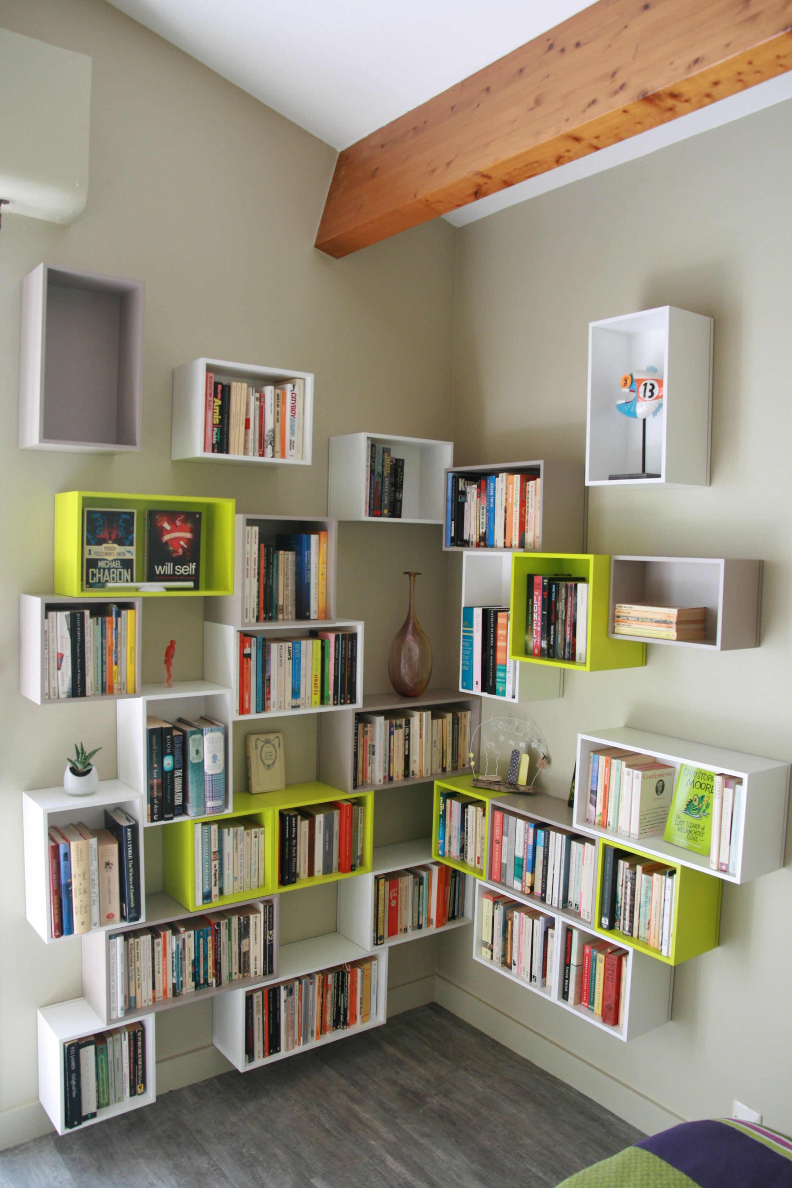 decorative shelves, white yellow boxes in the corner