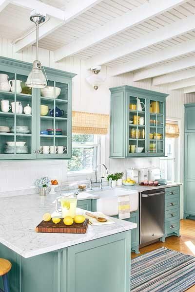 kitchen, white marble top, green wooden cabinet and cupboard, white wall, white wooden ceiling and beams, white pendant
