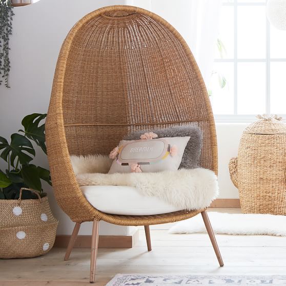 rattan woven chair with white cushion