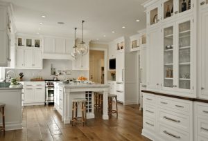 big white kitchen cabinets drawers dining chairs chandelier wall cabinets modern stove knife faucets ceiling lamps