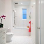 white bathroom ideas white door bathtub towel ceiling lamp drawer vase flower toilet shower window