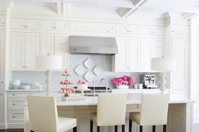 white kitchen upholstered dining chairs wall cabinet pink flowers plates cups white ceiling stove metal faucet