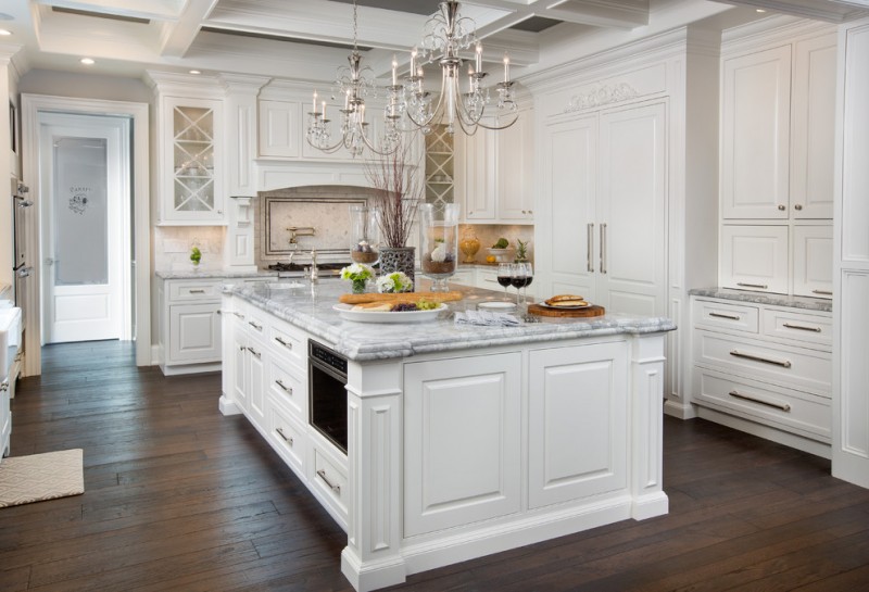 cashmere countertops kitchen wood floor white cabinets drawers chandelier door ceiling lamp appliances