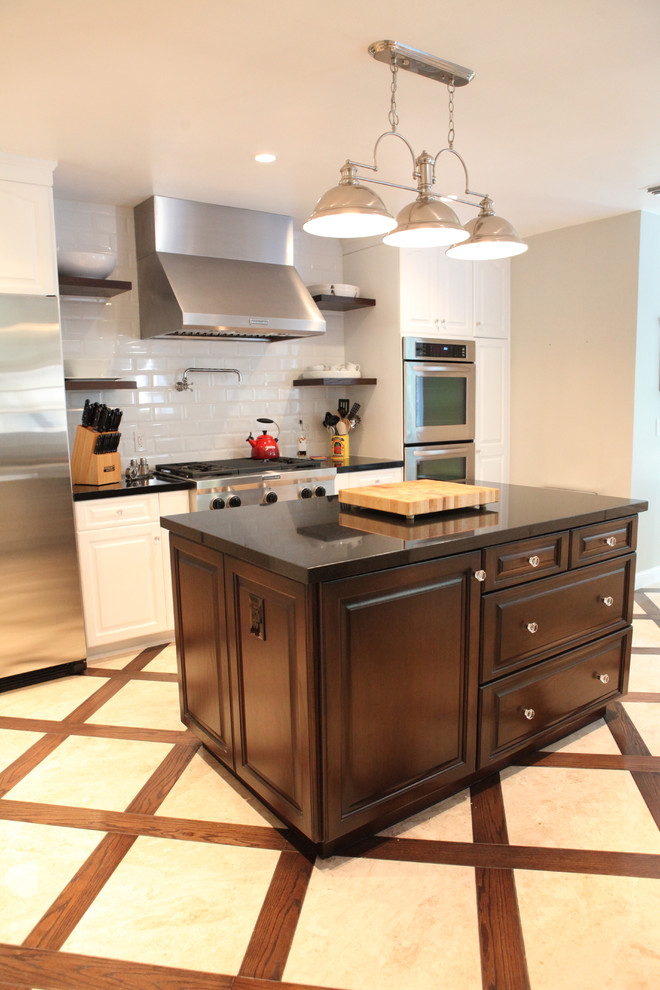 kitchen flooring wood frames crossing patterns cooking knives hanging lamps stove storage space drawers appliances
