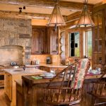 two floor stone and log house chairs kitchen dining table wood floor windows glass cabinets stove logs stones