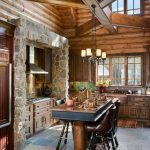 Two Floor Stone And Log House Kitchen Dining Chairs Table Windows Cabinets Floor Tile Lighting Hanging Lights