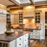 soapstone kitchen island carpet cabinets shelves hardwood floor farmhouse kitchen lamps