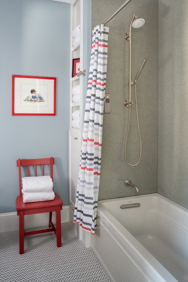 beach themed bathroom idea beige walls light blue wall with wall art multicolored mosaic tiles floors Whirpool bathtub in white red chair multicolored shower curtain with stainless steel curtain rod