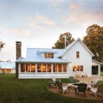 luxury ranch house plans white walls chimney patio chairs fire pit side wing windows farmhouse design