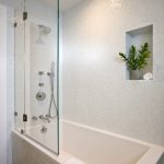 tub shower combo soaking tub with shower half door white square tile glass wall shower mosaic tile