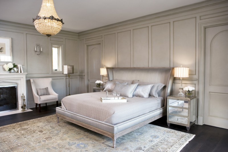 paris inspired bedroom carpet dark floor bed pillows flowers bedside tables lamps chair transitional room