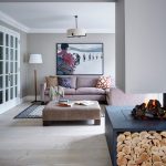 Contemporary Living Room Light Purple Sofa With Multicolored Accent Pillows Light Purple Center Table Light Toned Wood Floors Light Grey Walls Blue Fireplace With Under Logs Storage