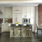 kitchen with white marble top kitchen island with dark wooden bar stools with 4 feet