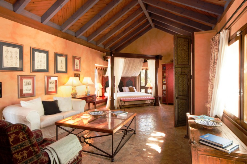 moroccan inspired bedroom cassava walnut pillow moroccan headboard armchair and doors double shade window moroccan side table