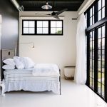 Black And White Bedroom 1 Light Maple Ceiling Fan Industrial Lamp Glass Sliding Doors And Windows With Black Frame White Curtain White Bed And Floor