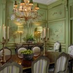 Green Dining Room Crystal Chandelier Dining Chairs And Table Gold Accents Candles Table Lamps Fruit Bowl