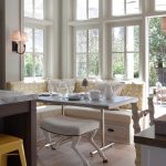 Corner Bench Seating With Storage Small White Bench White Table Wall Sconces Wooden Floor Yellow Back Cushion White Pillows White Framed Glass Windows