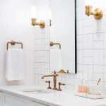 Bathroom With White Tiles, White Sink And Cabinet, Square Mirror, Golden Faucet