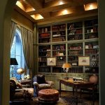 Classic Home Library With Green Wooden Bookcase, Brown Rug, Chairs, Ottoman, Curtain
