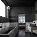 Long Large Bathroom With Black Herringbone Pattern Floor, Gery Tub, Grey Sink With Cabinet, Glass Pendant
