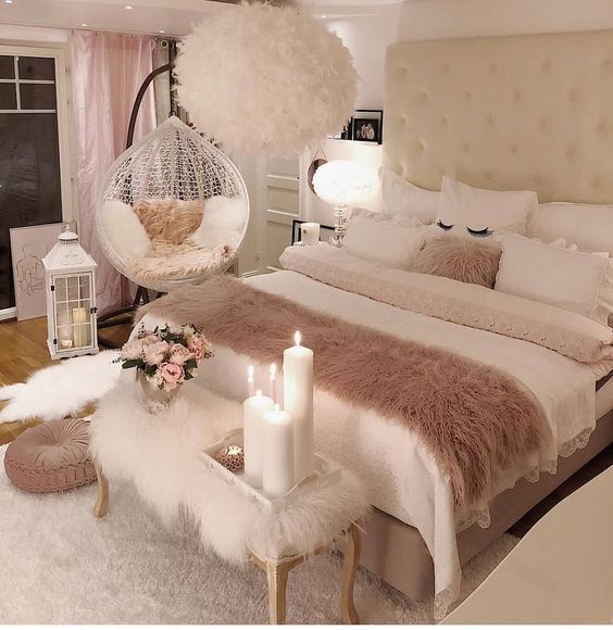 bedroom, wooden floor, white rug, white fur bench, white bedding, white wall, white fur chandelier, white swing chair