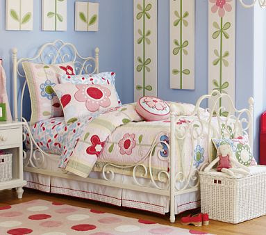 kids bedroom, wooden floor, white iron bed, blue wall, wall decoration, flower bedding, white bedside table, white basket