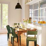 Dining Set With Wooden Table, Green Metal Chair, Black Pendant, Wooden Floor, White Wall, White Parition With Glass