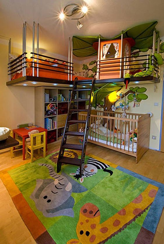 nursery with wooden floor, animal printed rug, white wall, wooden cribs, bed upstairs, dark wooden stairs, tent, low talbe and chair, shelves