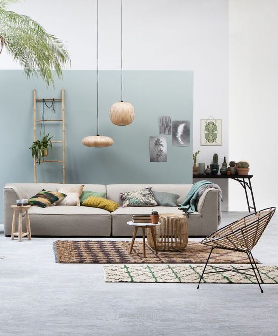 10 living room, grey floor, white blue wall, grey sofa, rattan chair, rattan ottoman, round low side table, rattan pendants