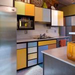Kitchen, Off White Floor, Grey Backsplash, Colorful Doors On Cabinet, White Kichen Top, Grey Island