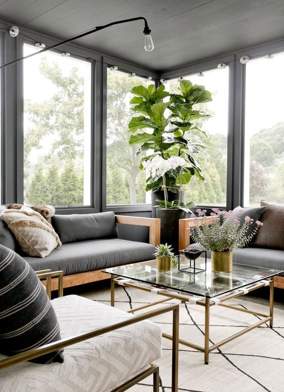 sun rooms, white rug, wooden sofa with grey cushions, grey pillows, large windows