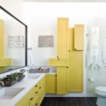 Bathroom Storage Cabinets Yellow Cabinet Yellow Floating Vanity White Countertop Glass Shower Door Wall Mirror Double Sink Wall Mounted Faucets Dark Floor Tile Toilet
