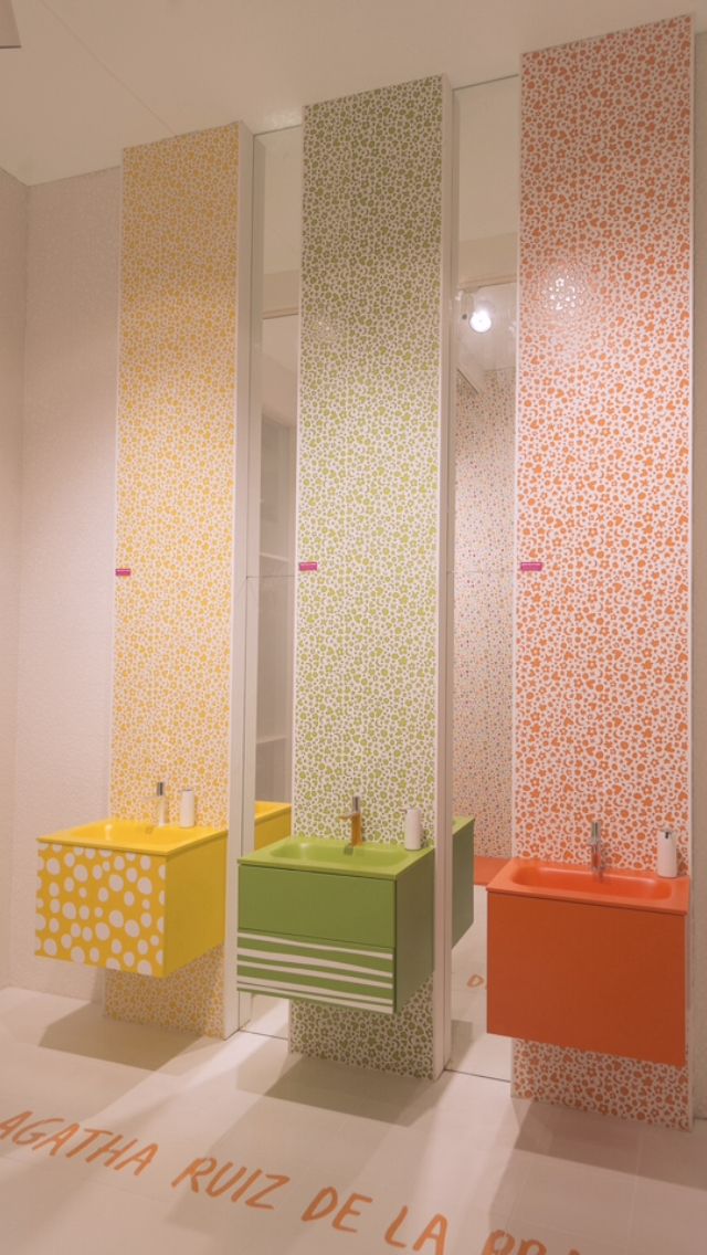 kids toilet, orange, yellow, green floating vanity, beige floor, beige wal