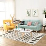 Living Room, Wooden Floor, White Wall, Patterned White Black Rug, White Nesting Coffee Table, Green Sofa, Yellow Chair, White Side Table