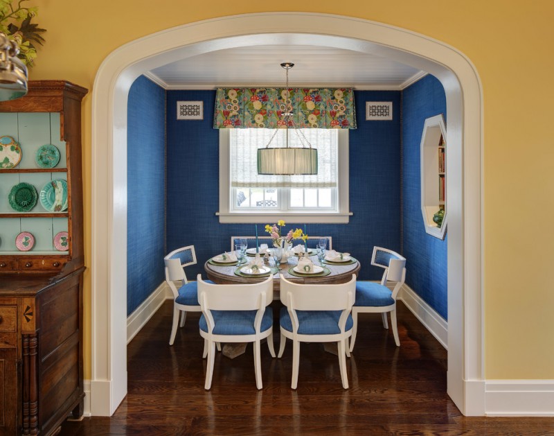 window valance white framed window white and blue chairs wooden floor blue walls colorful valance round pedestal dining table chandelier