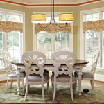 Window Valance White Glass Windows Wooden Floor Patterned Area Rug White Dining Table Pendant Lamps Tan Walls Whte Chairs