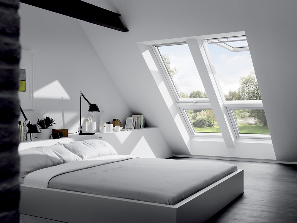 bedroom, dark floor, white wall, white sloping wall, grey bed, white indented wall for shelves